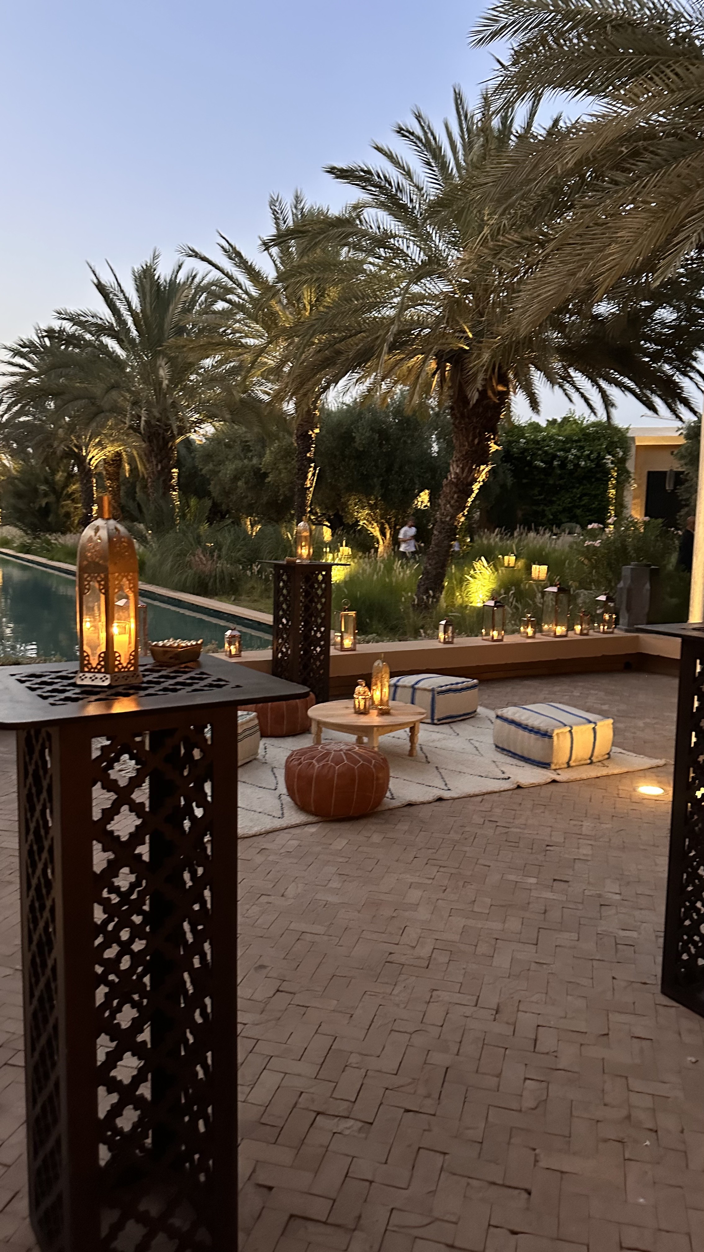 One Thousand and One Nights soirée at the Mandarin Oriental Marrakech — clouds of pierced brass lanterns, candlelit tablescapes and gold accents, produced by SBAI Events Production