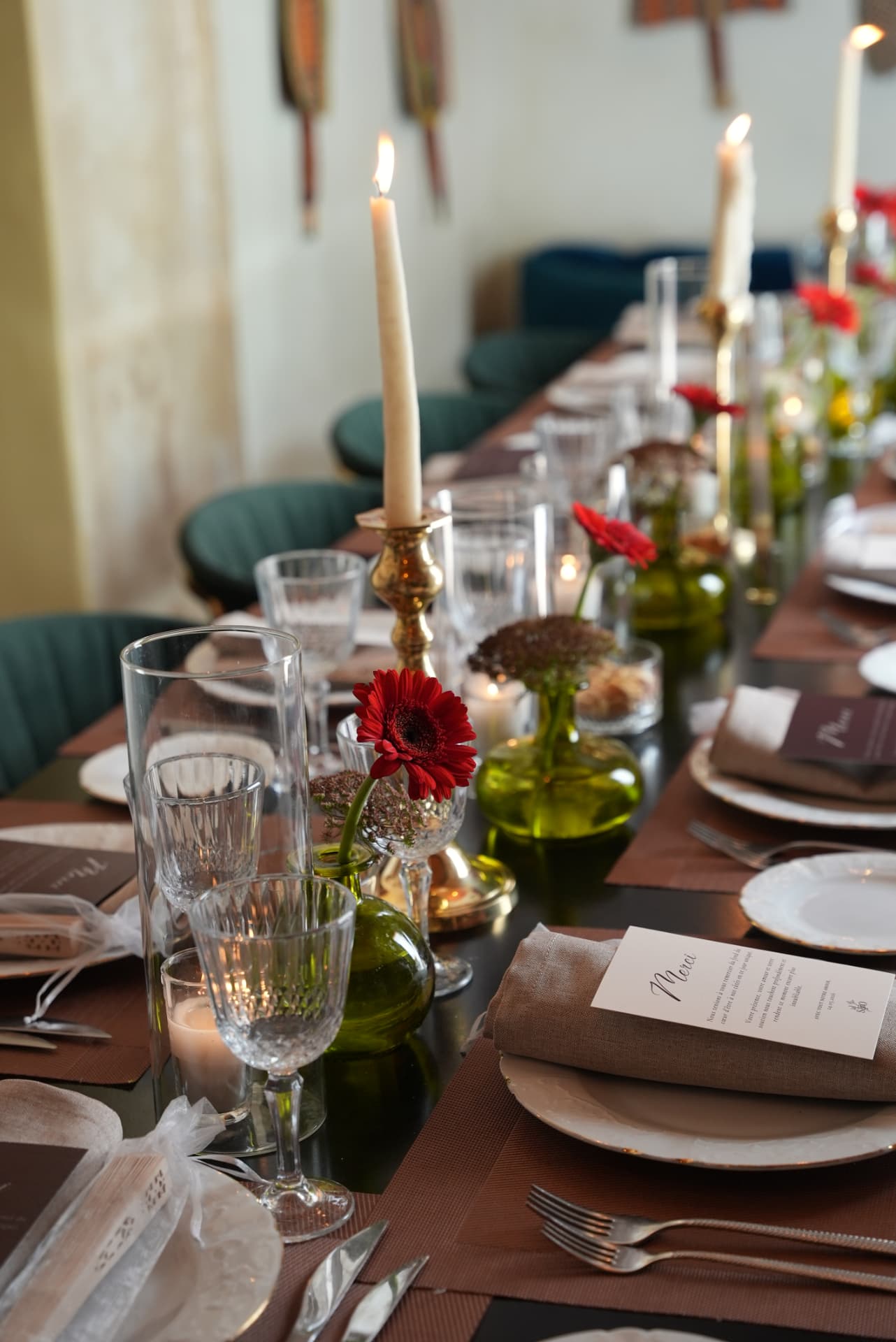 Wedding at Dar Dada Casablanca — gilded welcome mirror, crimson and burgundy floral centerpieces, zellige tables and candlelight, produced by SBAI Events Production
