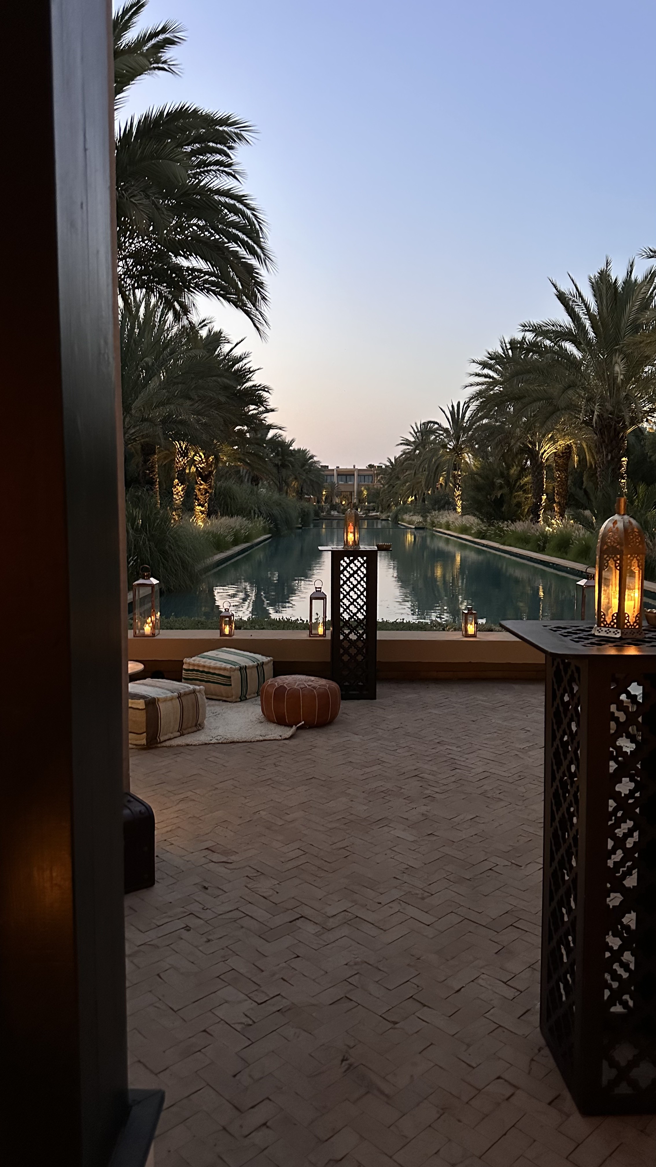 One Thousand and One Nights soirée at the Mandarin Oriental Marrakech — clouds of pierced brass lanterns, candlelit tablescapes and gold accents, produced by SBAI Events Production