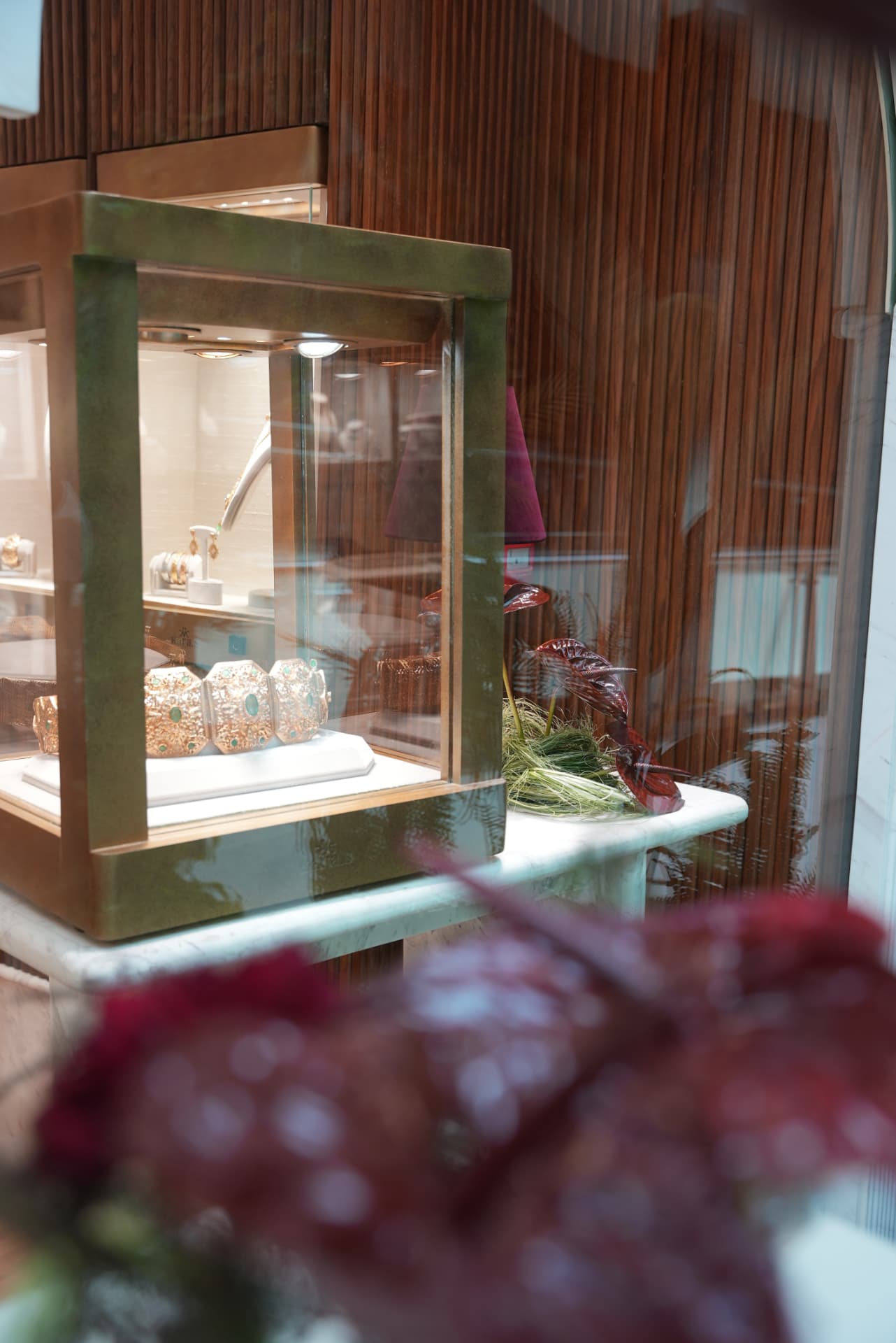 Kara.S boutique opening at Morocco Mall — burgundy anthurium and pink cymbidium installations, silver coupes and brass tables, produced by SBAI Events Production