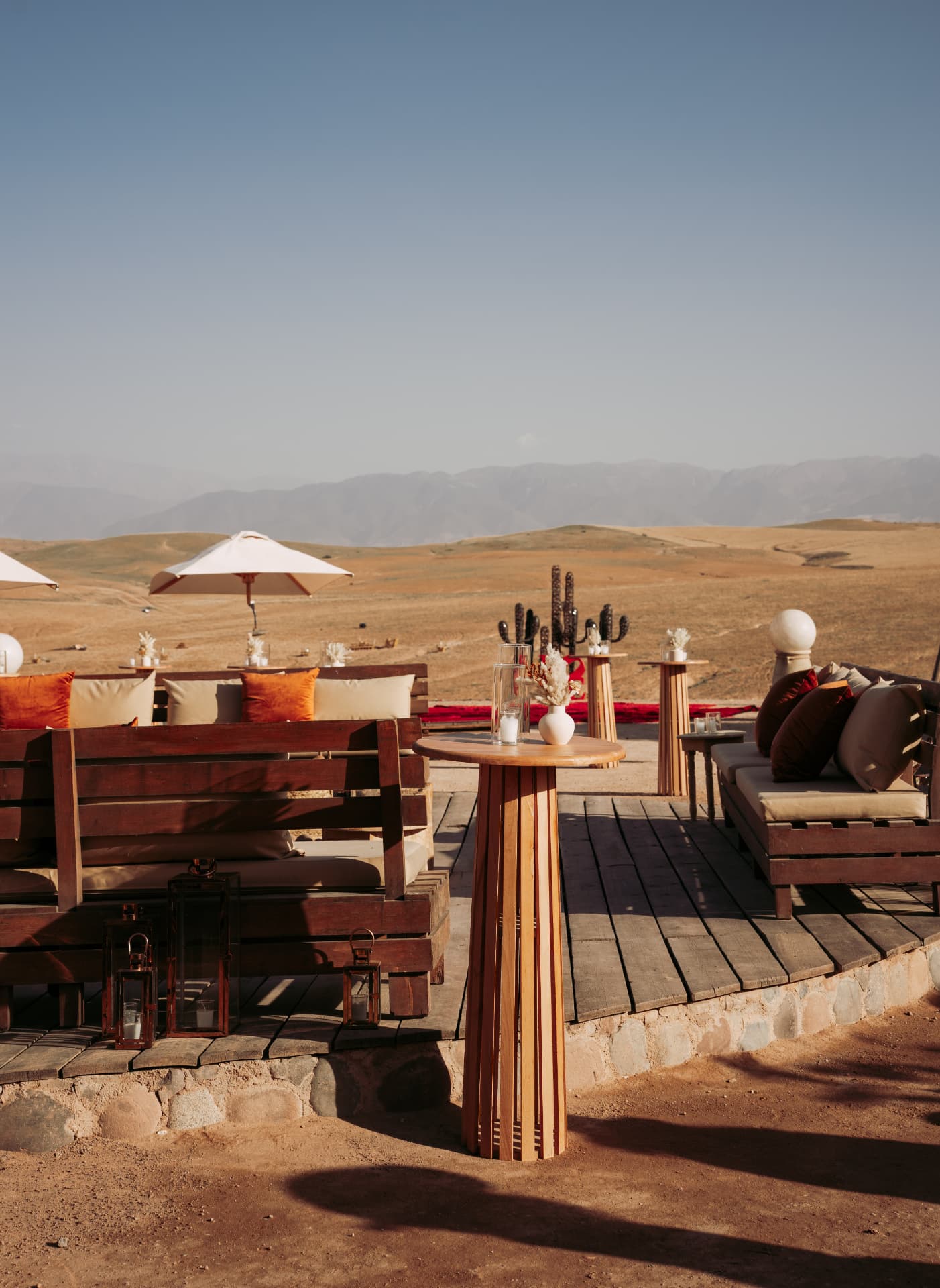 Celebration in the Agafay desert near Marrakech — equestrian performance in red, desert lounges, pampas tablescapes and fireworks, produced by SBAI Events Production