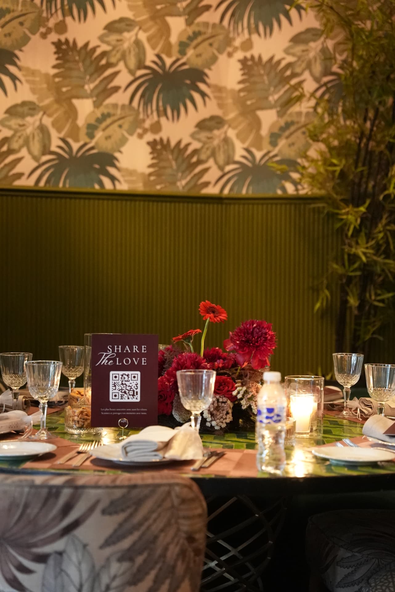 Wedding at Dar Dada Casablanca — gilded welcome mirror, crimson and burgundy floral centerpieces, zellige tables and candlelight, produced by SBAI Events Production