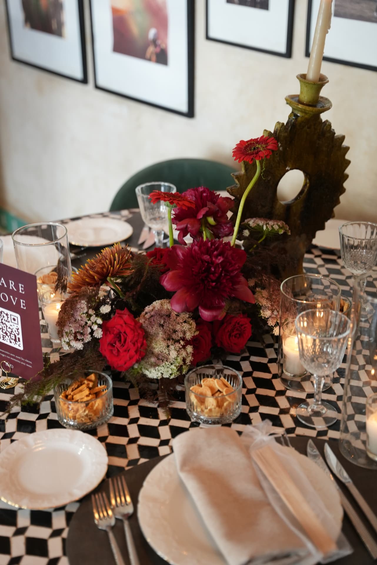 Wedding at Dar Dada Casablanca — gilded welcome mirror, crimson and burgundy floral centerpieces, zellige tables and candlelight, produced by SBAI Events Production